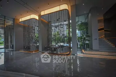 Luxurious modern building entrance with elegant lighting and sleek design
