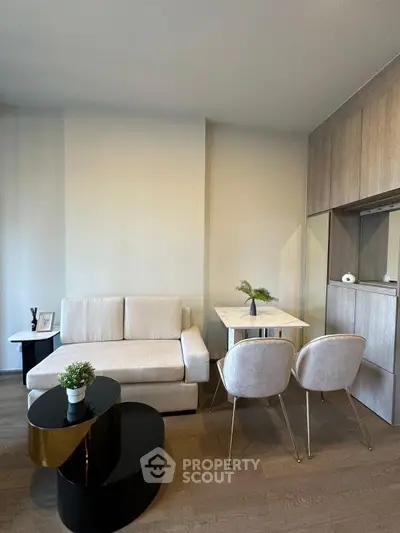 Modern living room with stylish furniture and elegant decor in a cozy apartment setting.
