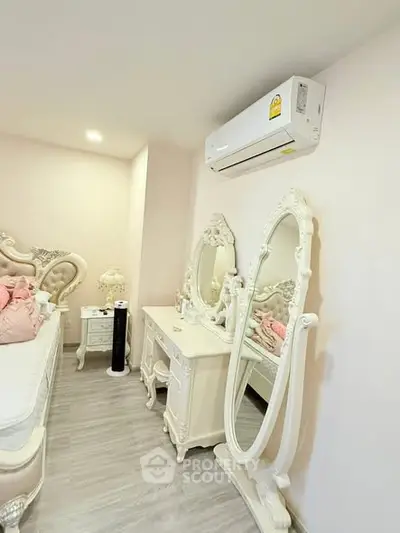 Elegant bedroom with vintage furniture and modern air conditioning