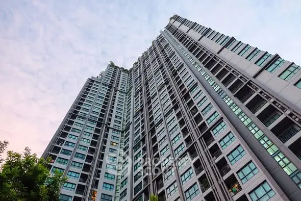 Stunning high-rise building with modern architecture and expansive glass windows.