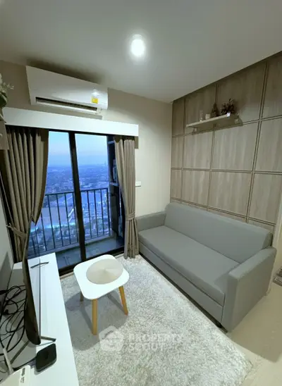 Modern living room with balcony view in high-rise apartment
