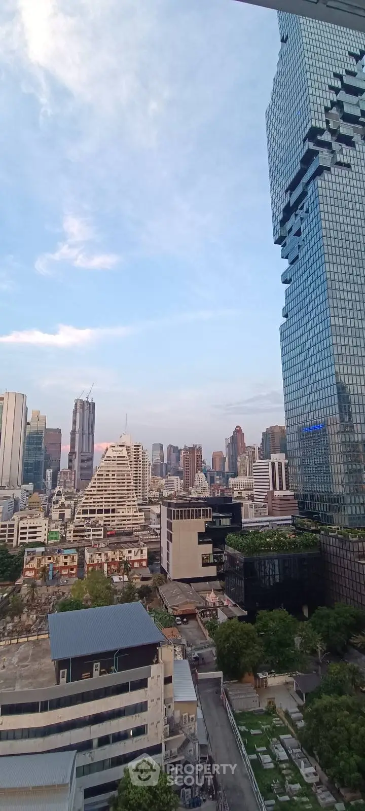 Stunning cityscape view showcasing modern skyscrapers and urban architecture under a clear blue sky.