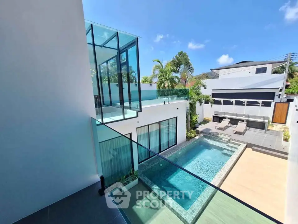 Luxurious modern villa with private pool and spacious terrace, perfect for relaxation and entertainment.