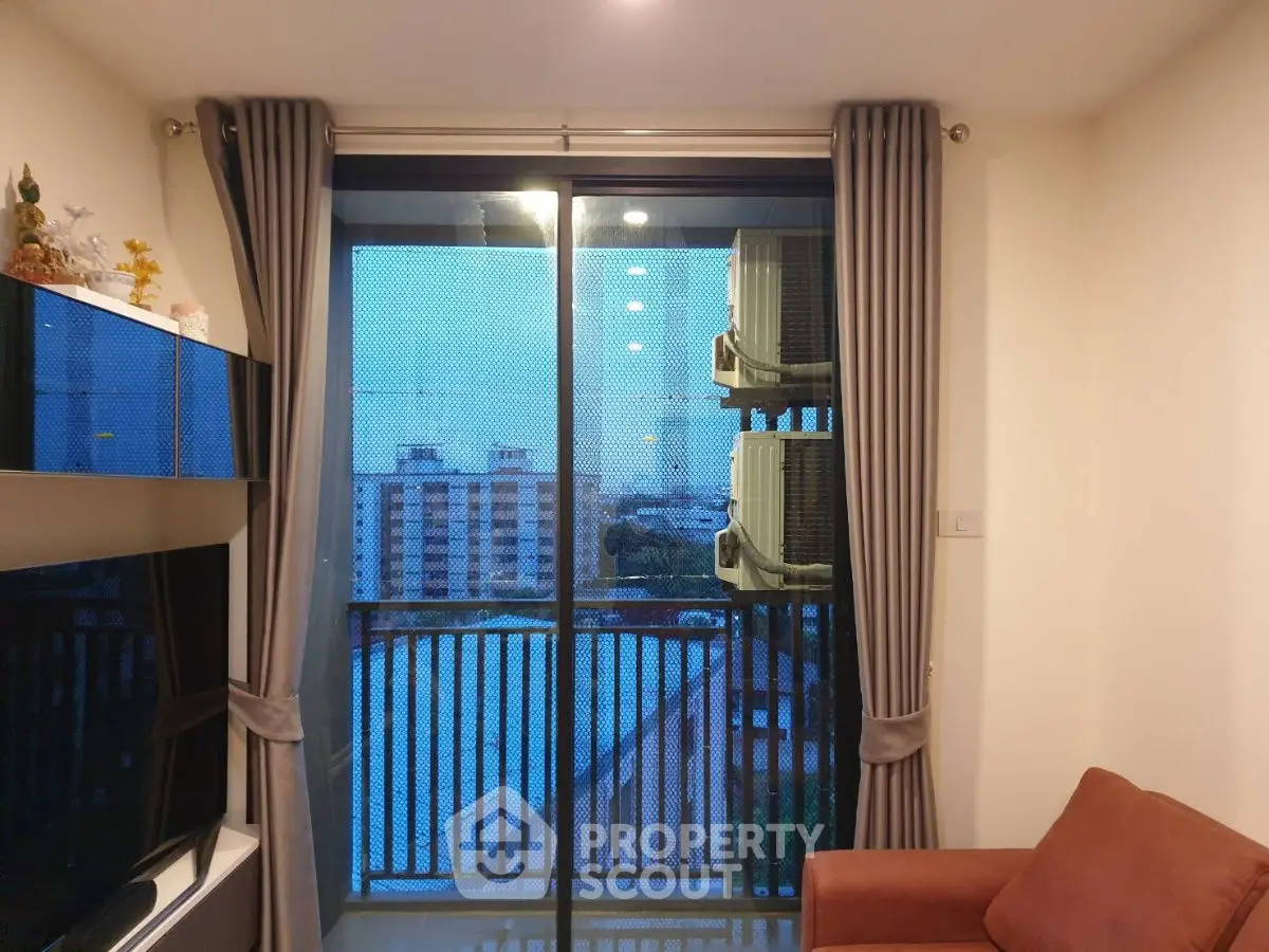 Cozy living room with balcony view in modern apartment