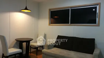 Cozy living room with modern lighting and comfortable seating