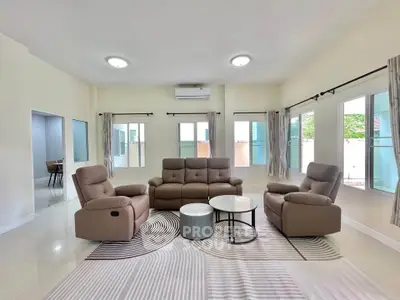Spacious modern living room with elegant furniture and natural light