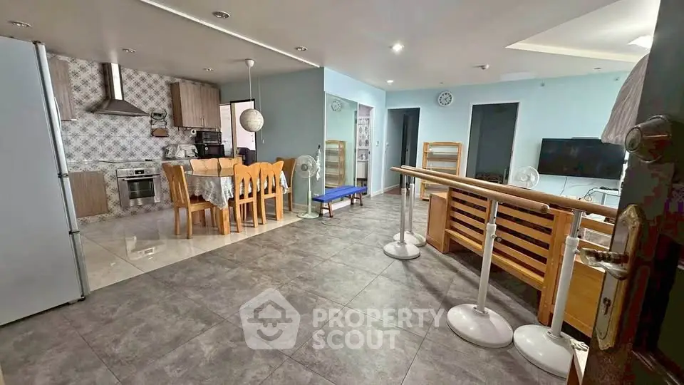 Spacious open-plan kitchen and living area with modern appliances and stylish decor.