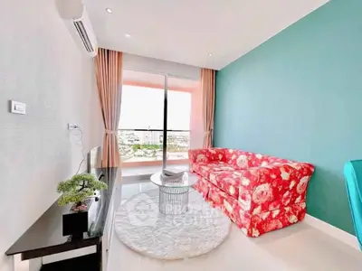 Chic living room with floral sofa and balcony view in modern apartment