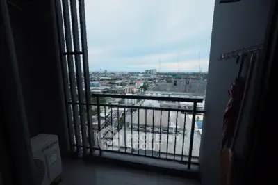 Stunning high-rise balcony view overlooking cityscape with expansive skyline.
