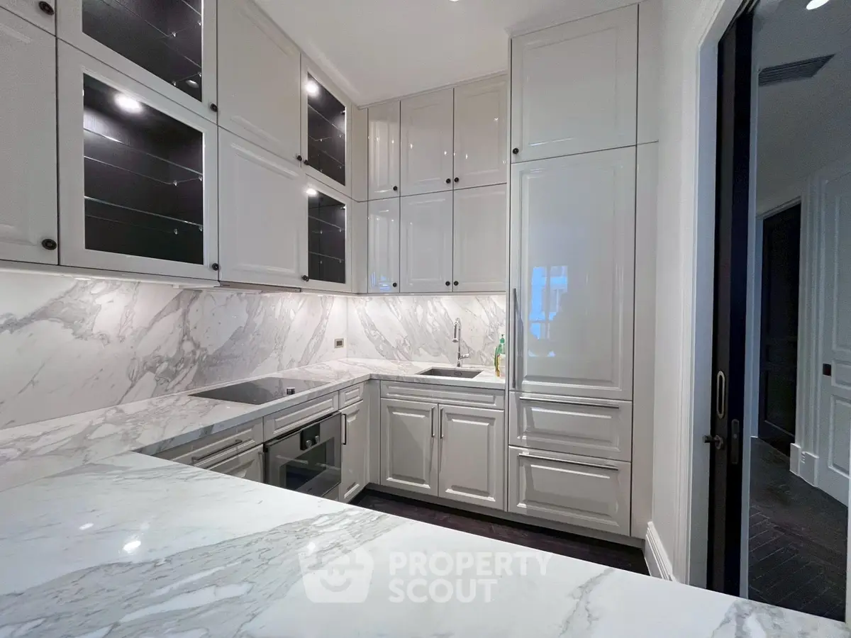 Luxurious modern kitchen with marble countertops and sleek cabinetry