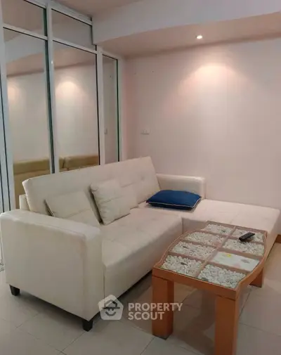 Modern living room with sleek white sofa and stylish decor