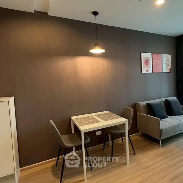 Modern living room with cozy sofa and dining area, perfect for urban living.