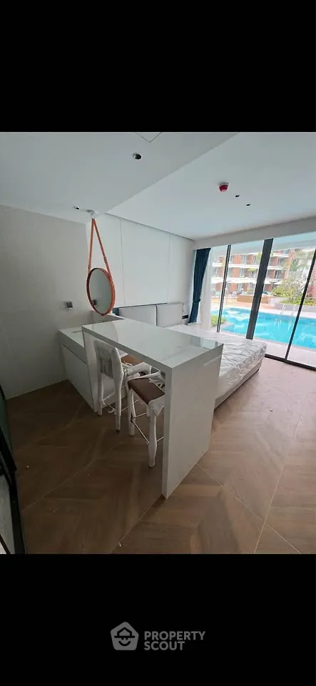 Modern bedroom with pool view and stylish decor