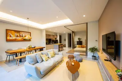 Spacious modern living room with open kitchen and stylish decor