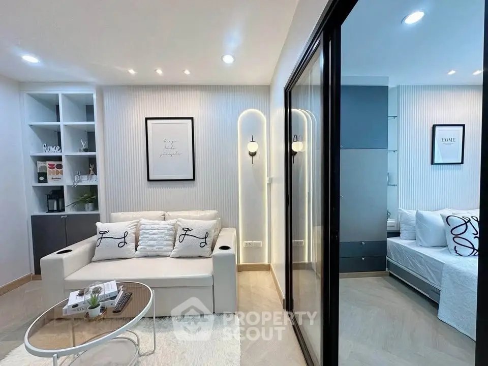 Modern living room with elegant decor and cozy seating area in a stylish apartment.