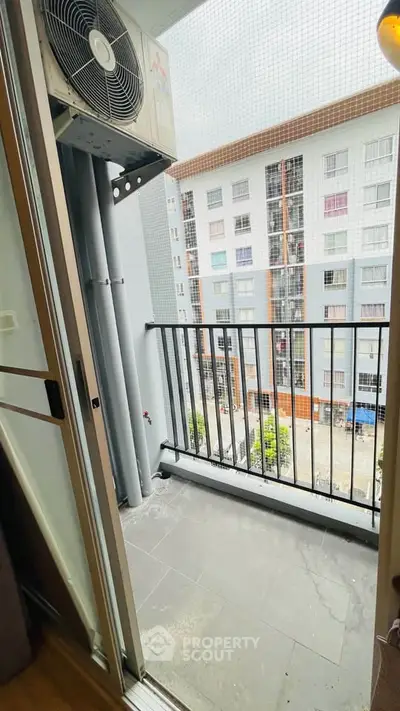 Charming balcony with city view, perfect for relaxation and enjoying urban living.