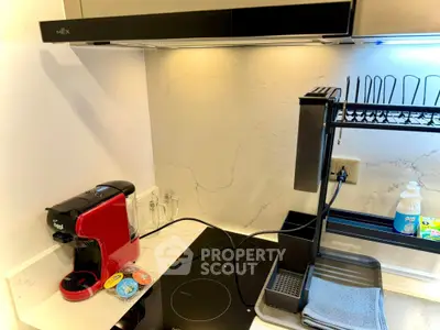 Modern kitchen corner with sleek appliances and coffee maker
