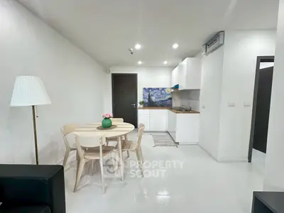 Modern open-plan kitchen and dining area with stylish decor