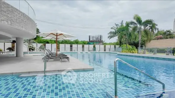 Luxurious outdoor pool area with modern design and lush greenery