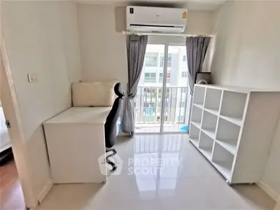 Bright study room with balcony access and modern furnishings