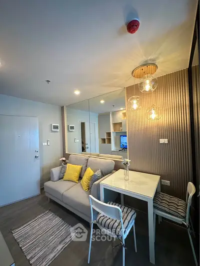 Modern living room with stylish decor and cozy seating area in a contemporary apartment.