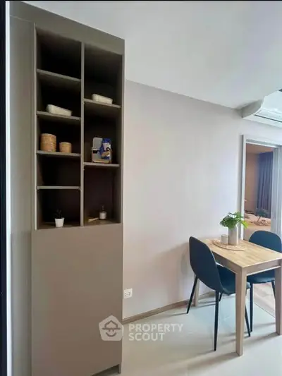 Modern dining area with sleek shelving and stylish table set