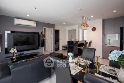 Modern living room with sleek furniture and open kitchen layout, perfect for stylish urban living.