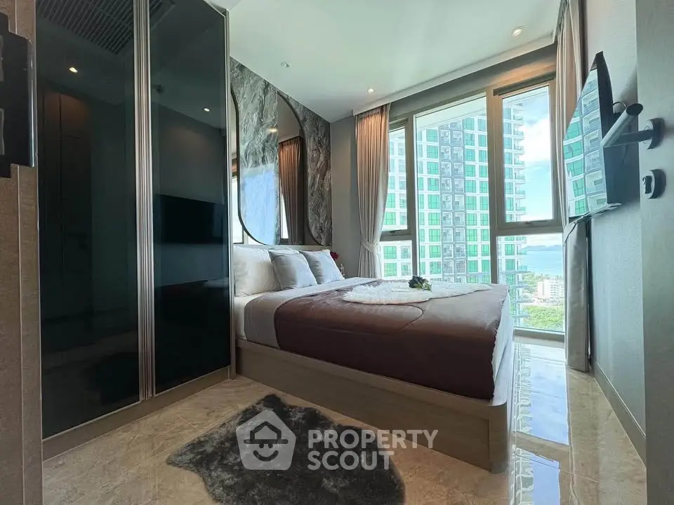 Luxurious modern bedroom with floor-to-ceiling windows and city view