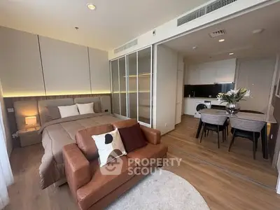 Modern studio apartment with cozy living area and stylish kitchen