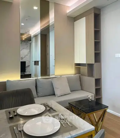 Modern living room with stylish decor and dining area in a contemporary apartment.