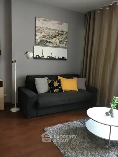 Stylish living room with modern decor and cozy seating area.