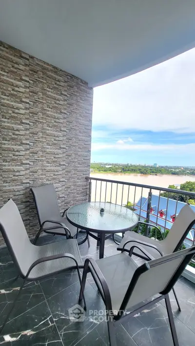 Spacious balcony with stunning view and modern outdoor furniture