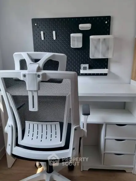 Modern home office with ergonomic chair and organized storage