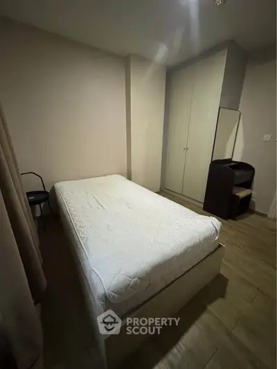 Cozy bedroom with minimalist design and ample storage space