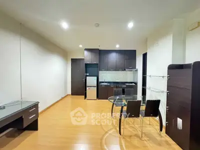 Modern open-layout kitchen with dining area and sleek furniture