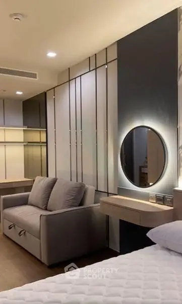 Luxurious modern bedroom with stylish decor and cozy seating area