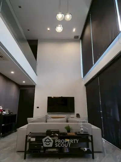 Luxurious modern living room with high ceiling and sleek design