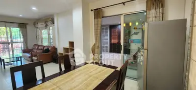 Spacious open-plan living and dining area with modern furnishings and natural light.