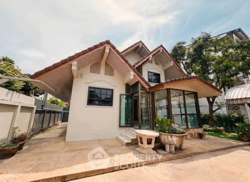 Charming single-family home with unique architectural design and spacious outdoor area.