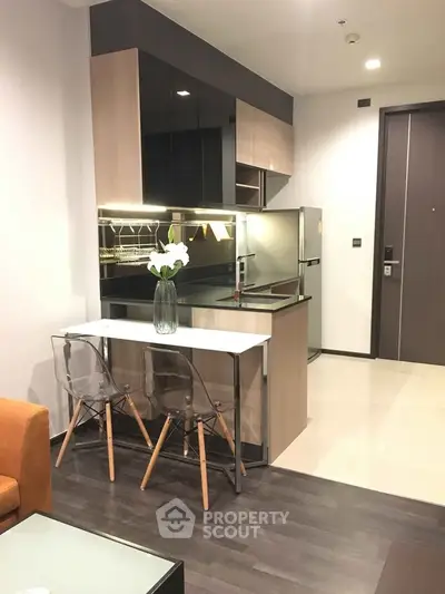 Modern kitchen with sleek design and open layout in stylish apartment