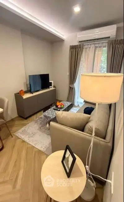 Cozy modern living room with stylish decor and natural light, perfect for relaxation and entertainment.