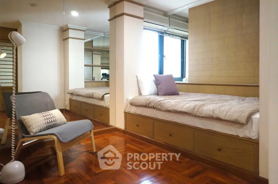 Cozy bedroom with built-in storage and stylish wooden flooring