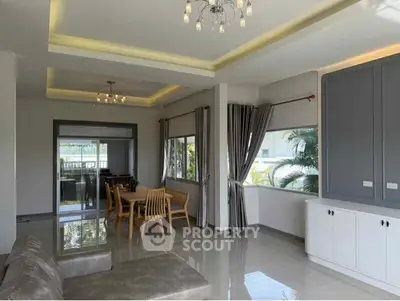 Spacious modern living room with elegant dining area and large windows