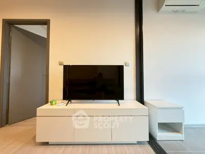 Modern living room with sleek TV stand and minimalist decor