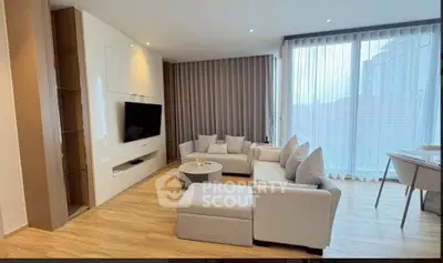 Spacious modern living room with elegant decor and large windows