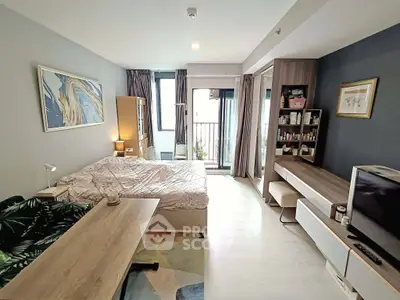 Modern studio apartment with stylish decor and balcony view