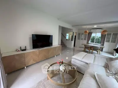 Spacious modern living room with elegant decor and open dining area