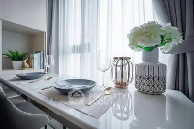 Elegant dining area with modern decor and natural light