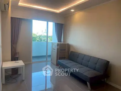 Modern living room with sleek sofa and balcony view