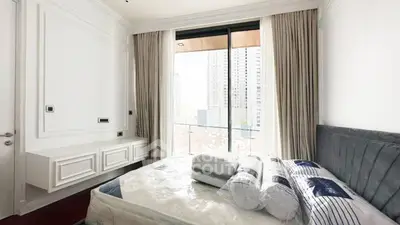 Luxurious bedroom with city view and elegant furnishings in modern apartment